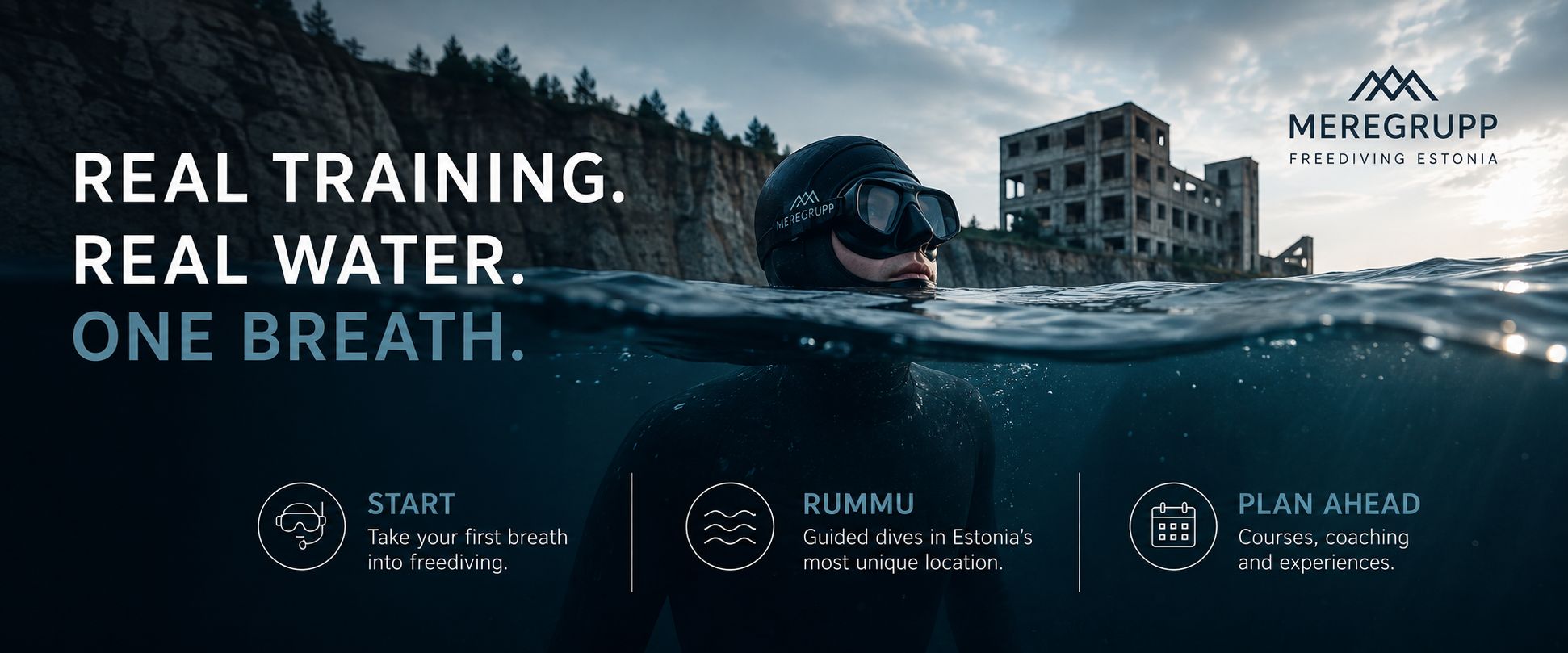 A freediver in a wetsuit at the water surface of Rummu quarry, the flooded prison ruins behind — real training, real water, one breath: start, dive Rummu, or plan ahead.